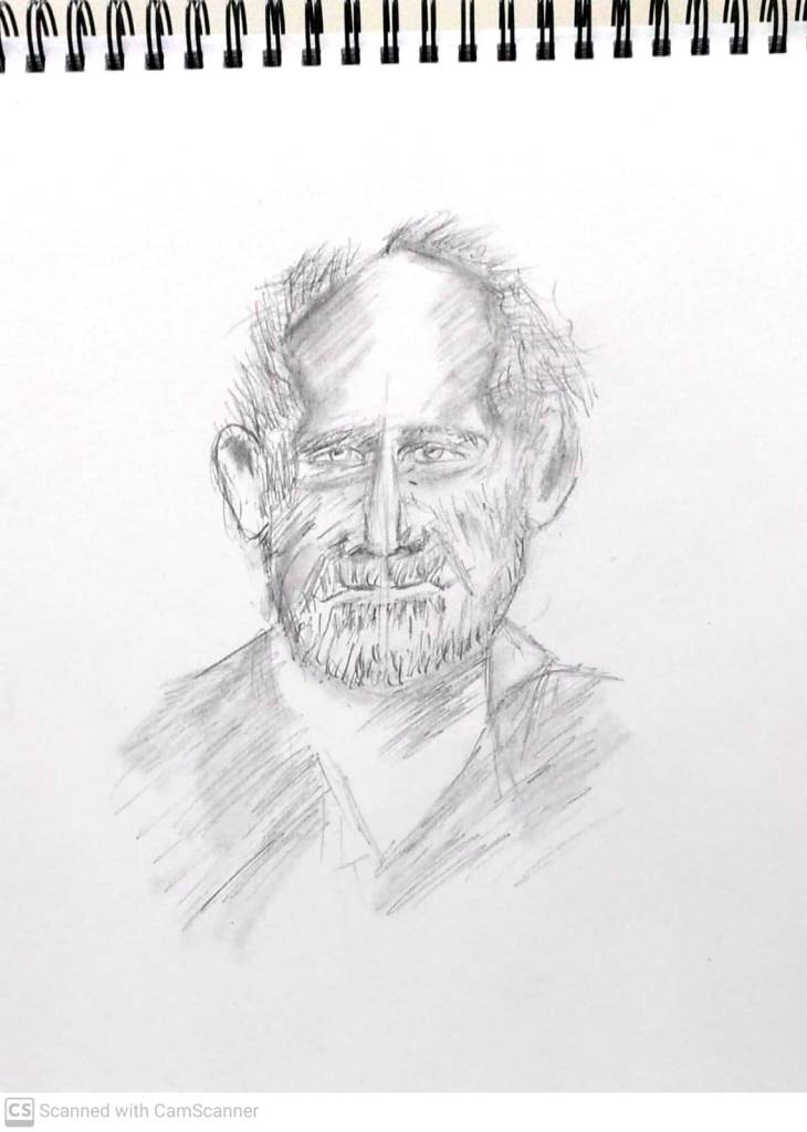 A pencil sketch of an elderly man's face with a beard, featuring expressive eyes and a thoughtful expression, on a blank page of a sketchbook.